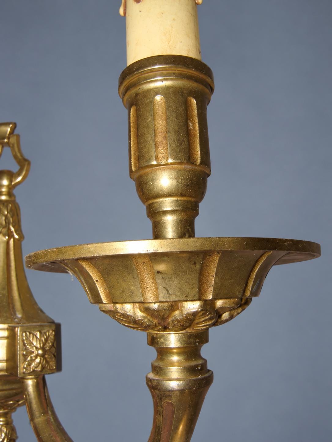 Vintage Pair of Louis XVI Style Gilt Metal Wall Sconces, Ring-Topped Baluster Backplates with Rosettes, Attributed Early 20th Century