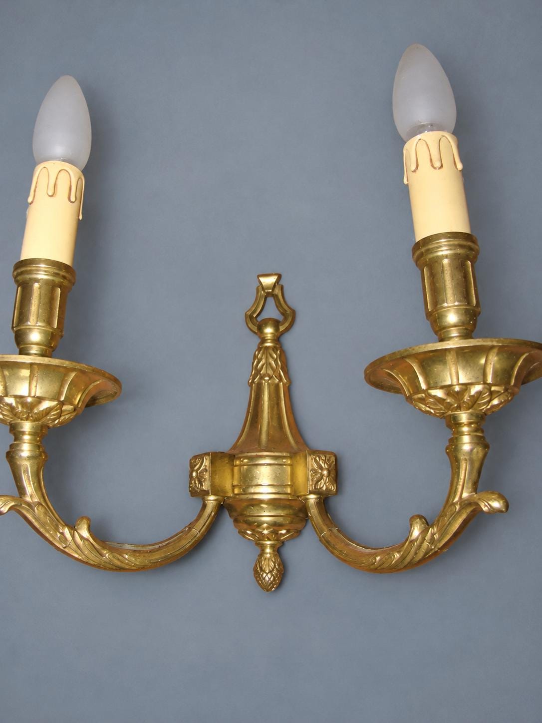 Vintage Pair of Louis XVI Style Gilt Metal Wall Sconces, Ring-Topped Baluster Backplates with Rosettes, Attributed Early 20th Century