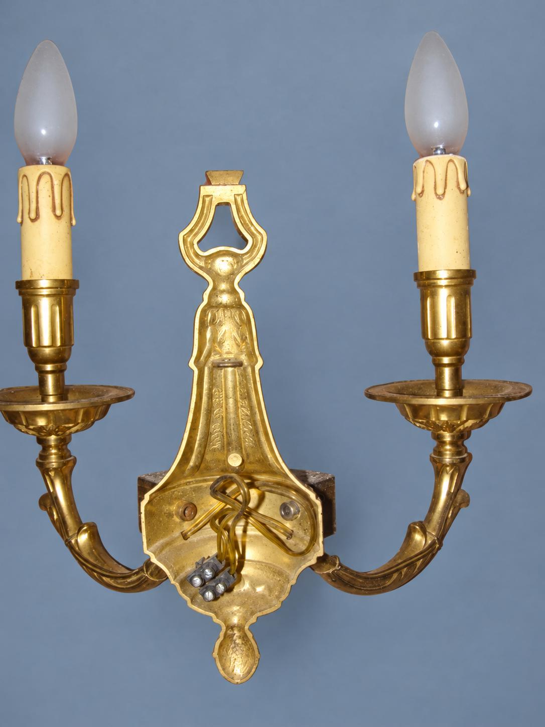 Vintage Pair of Louis XVI Style Gilt Metal Wall Sconces, Ring-Topped Baluster Backplates with Rosettes, Attributed Early 20th Century