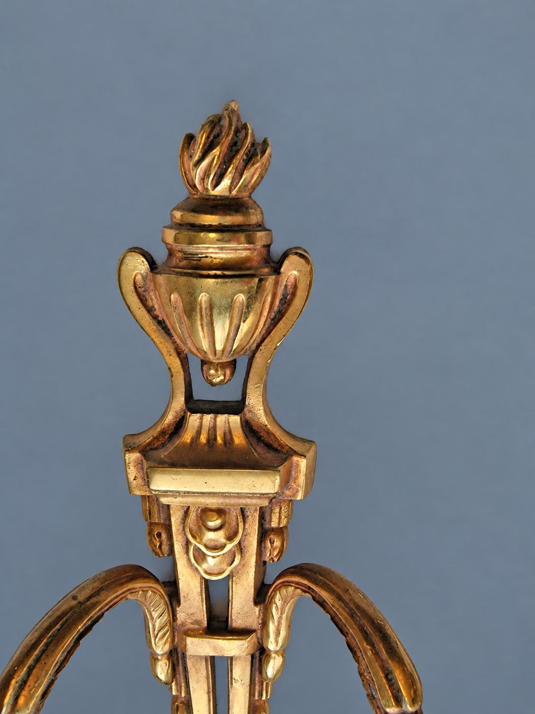 Vintage Pair of Louis XVI Style Two-Arm Candle Sconces, Gilt Metal with Flaming Urn Finials and Pierced Backplates, Late 19th Century, 26 cm