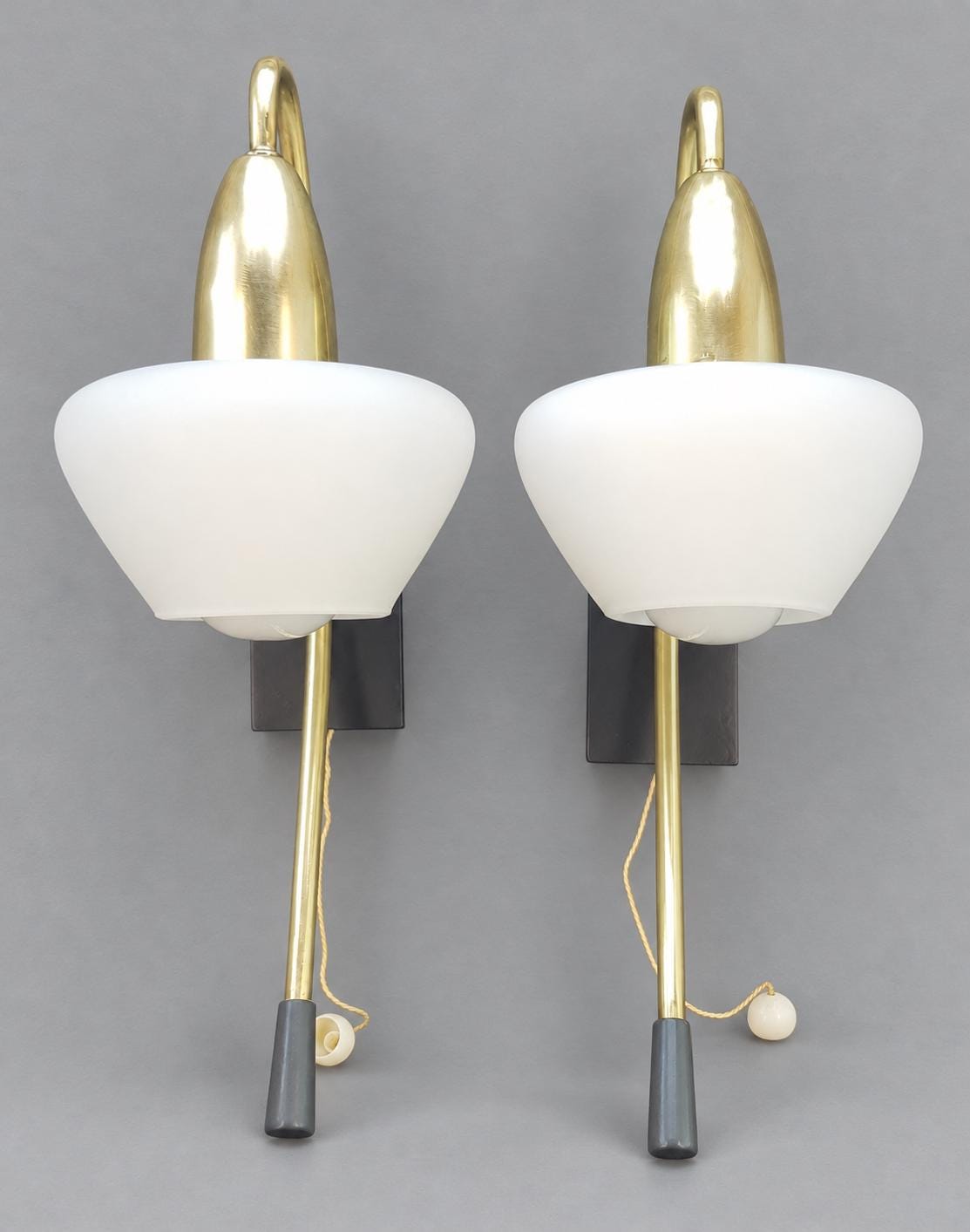 Vintage Pair of Mid-Century Modernist Wall Sconces, Attributed 1950s–60s, Brass Crook Arms with White Satin Glass Shades, Pull-Cord Switches