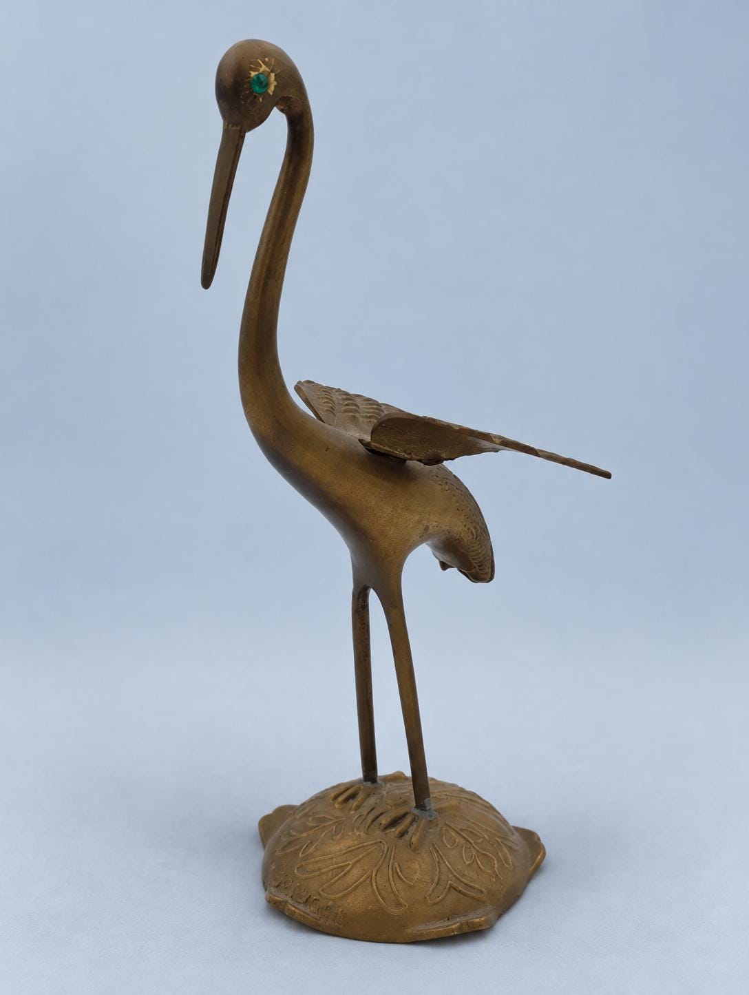 Vintage Brass Crane Figurine with Spread Wings and Green Eyes, Marked Portugal, Engraved Feather Detail on Leaf-Cast Base, 24 cm