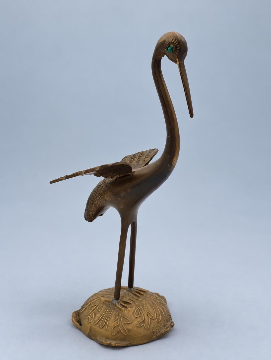 Vintage Brass Crane Figurine with Spread Wings and Green Eyes, Marked Portugal, Engraved Feather Detail on Leaf-Cast Base, 24 cm