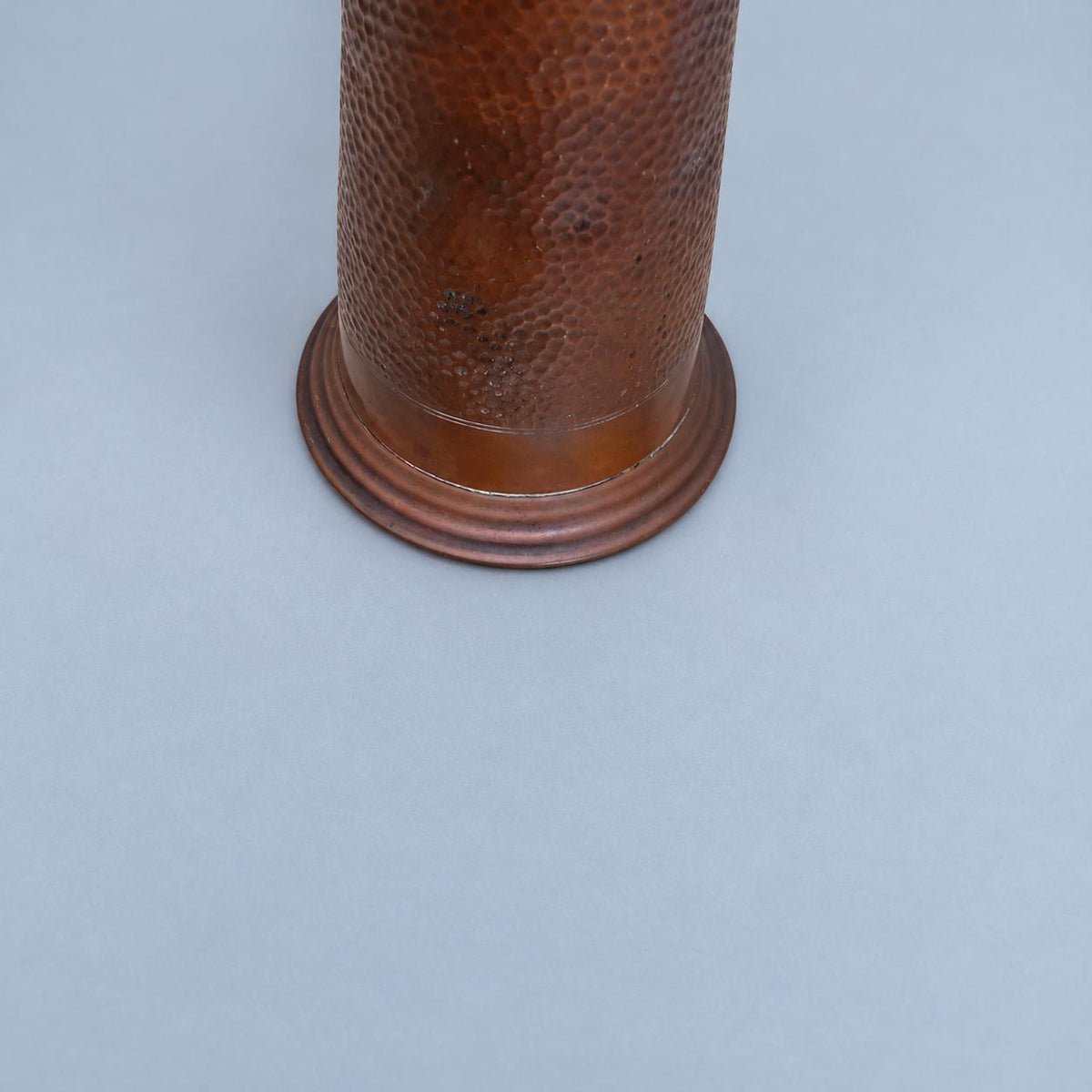 Vintage Art Nouveau Style Hammered Copper-Tone Vase with Angular Riveted Handles, Tall Tapering Form on Stepped Foot