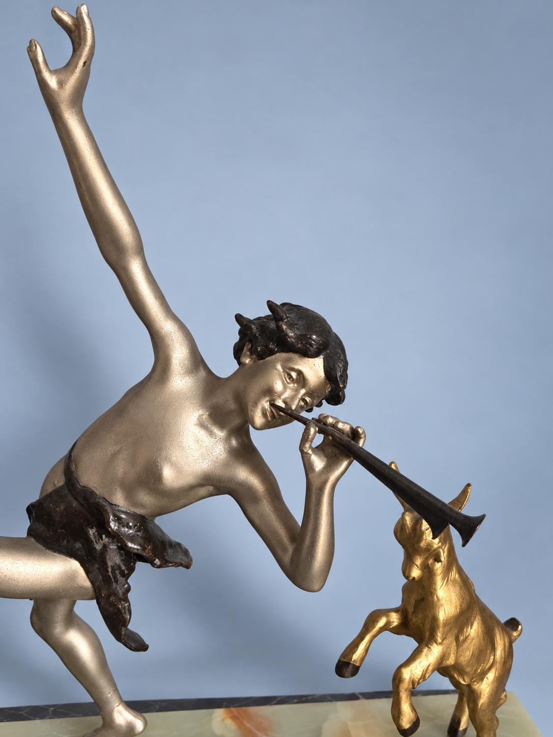 Vintage Art Deco Spelter Sculpture of Pan Playing Pipes with Leaping Goat, Silver and Gold Finish on Onyx and Black Marble Base