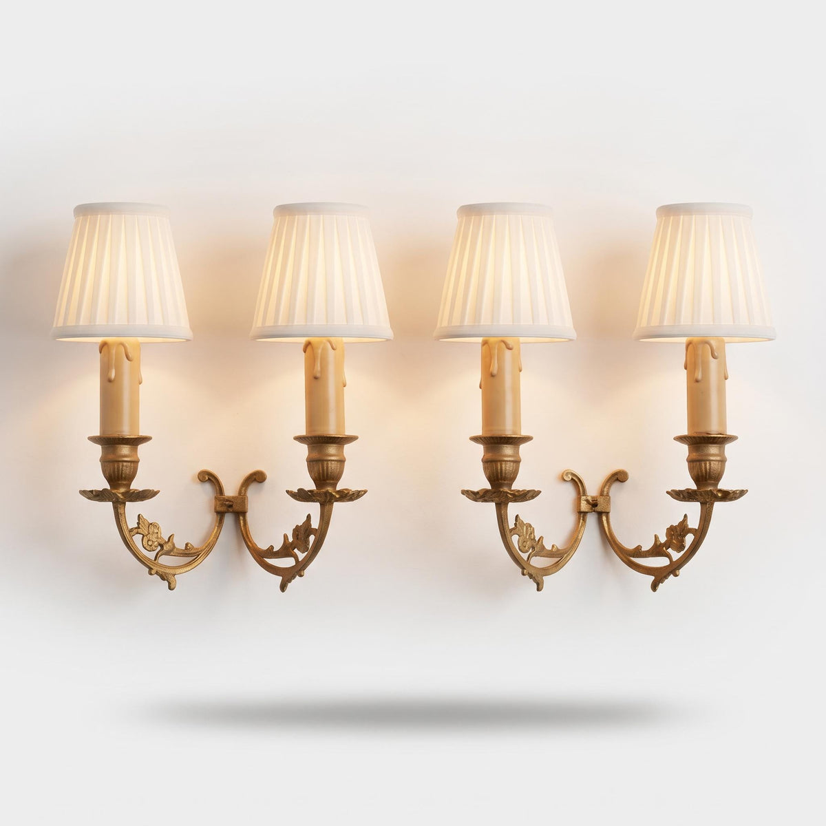 Vintage Pair of Louis XV Style Two-Light Wall Sconces, Gilt Brass with Openwork Floral Scroll Arms and Leafy Drip Pans, French Wall Lights
