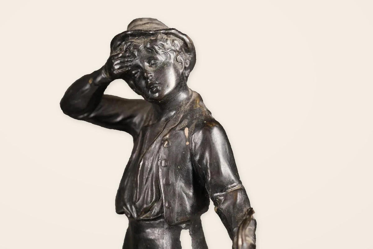 Pair of Antique Bronze Figures of Country Children, Girl in Bonnet and Boy Shading His Eyes, on Turned Bases, circa 1900