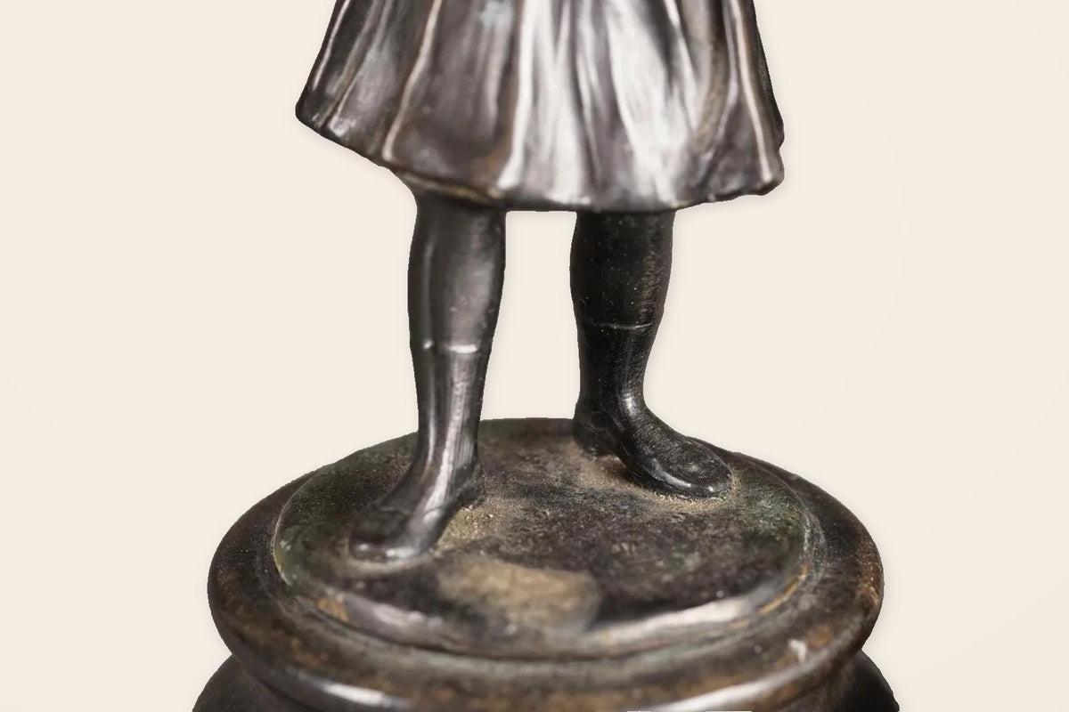 Pair of Antique Bronze Figures of Country Children, Girl in Bonnet and Boy Shading His Eyes, on Turned Bases, circa 1900