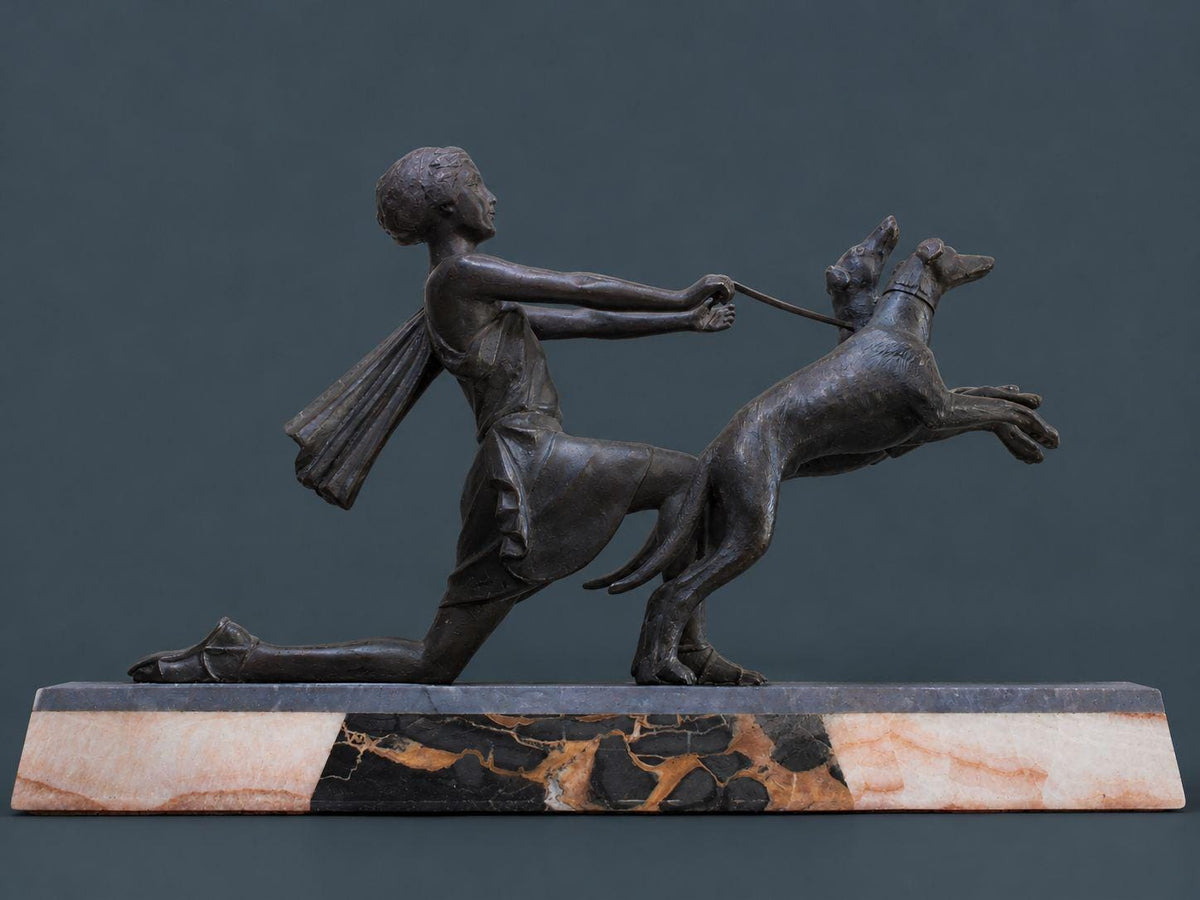 Vintage Art Deco Spelter Sculpture of a Kneeling Woman with Two Leaping Greyhounds on Marble Base, 1920s French Statue