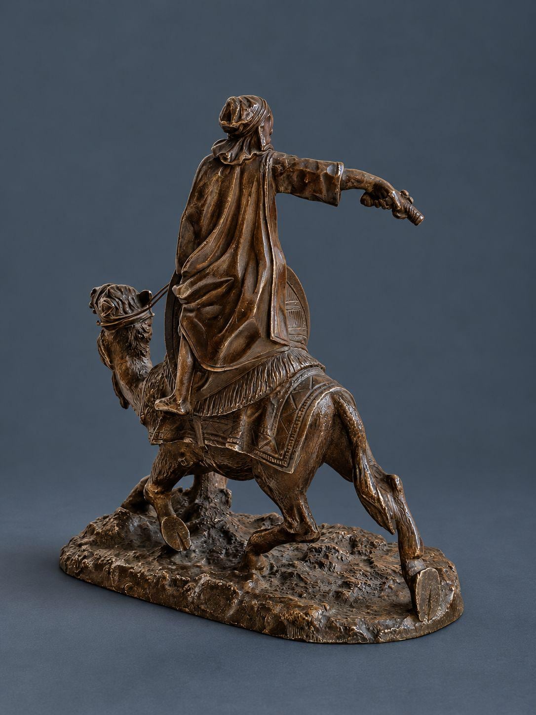 Antique Vienna Style Patinated Bronze Bedouin Rider on Camel, Orientalist Sculpture with Pistol and Wire Reins, circa 1900