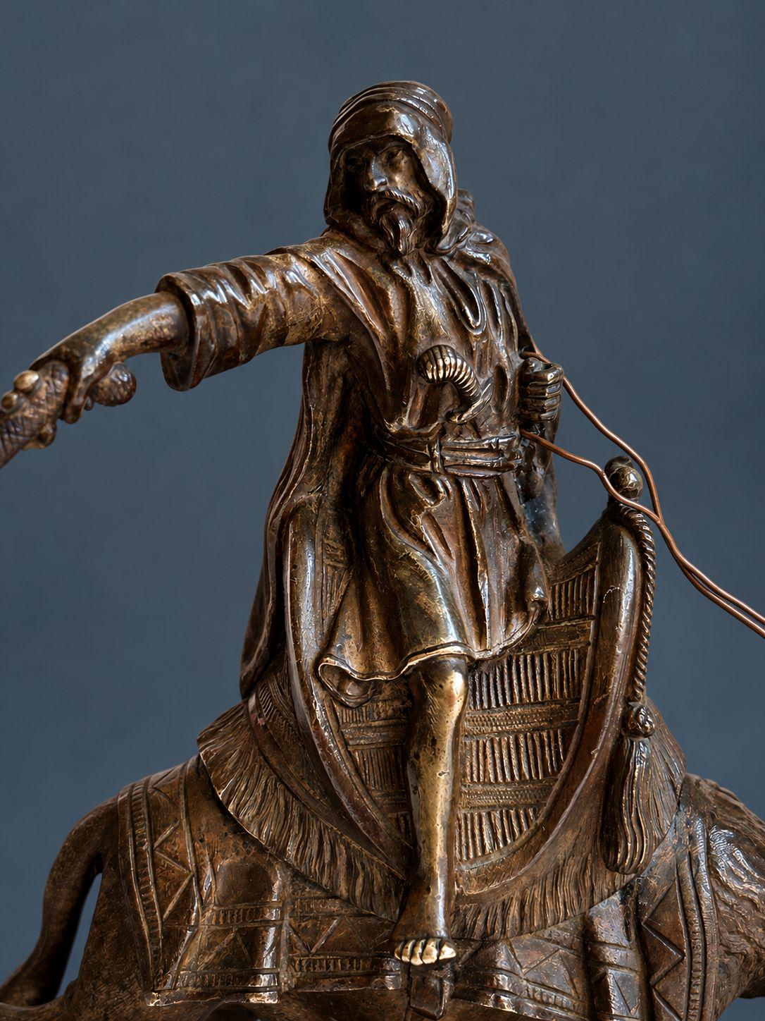Antique Vienna Style Patinated Bronze Bedouin Rider on Camel, Orientalist Sculpture with Pistol and Wire Reins, circa 1900