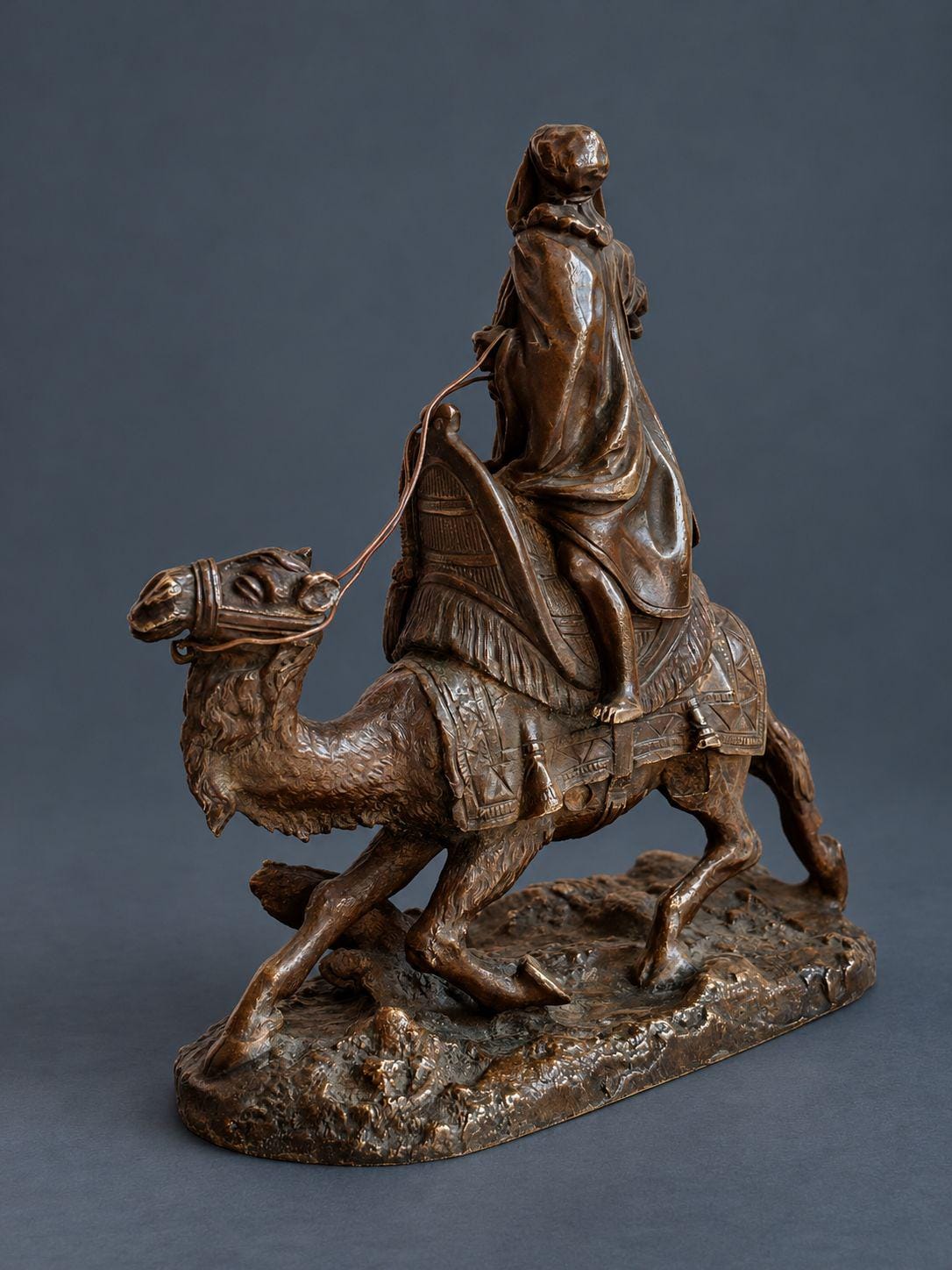 Antique Vienna Style Patinated Bronze Bedouin Rider on Camel, Orientalist Sculpture with Pistol and Wire Reins, circa 1900