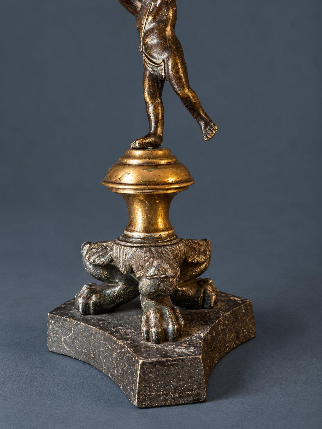 Pair of Antique Restauration Era Cherub Candlesticks, Bronze Putti Holding Brass Cups on Lion Paw Tripod Bases, 19th Century
