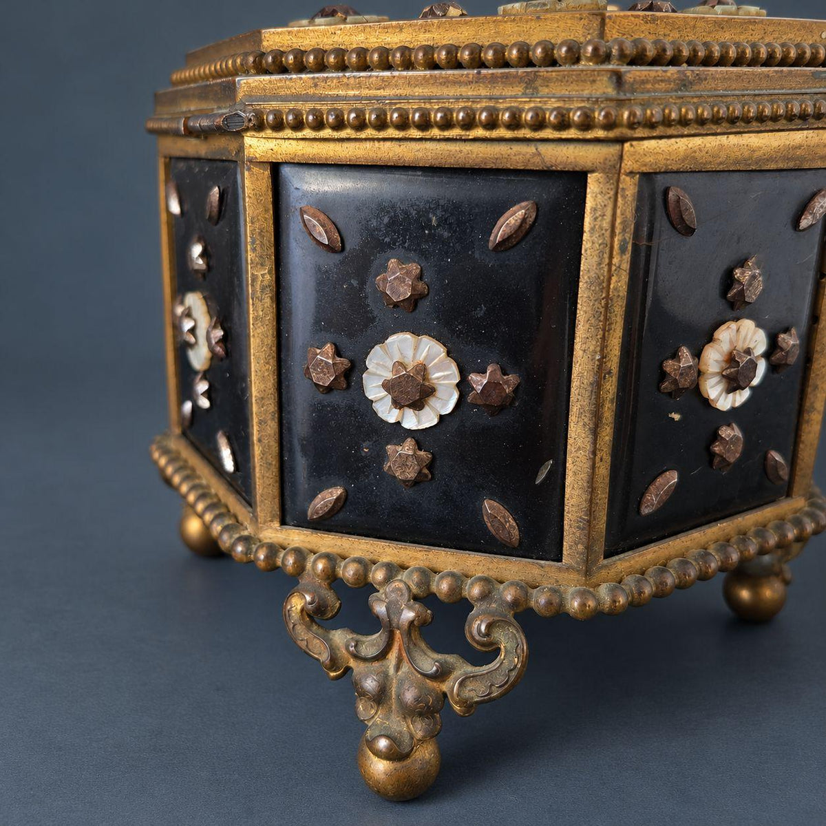 Antique Napoleon III Octagonal Jewelry Box with Mother of Pearl Flowers and Cut Steel Studs, Gilt Brass Frame on Ball Feet