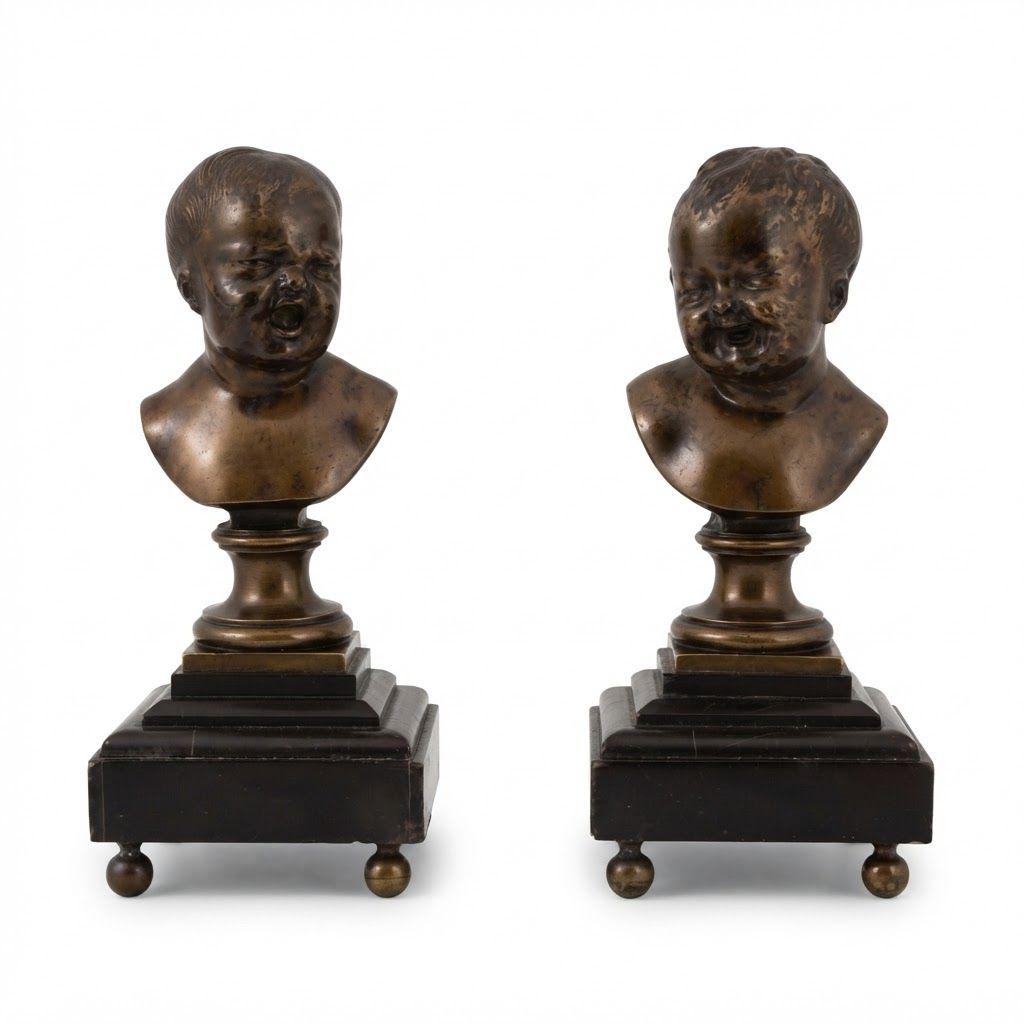 Pair of Antique Napoleon III Bronze Baby Busts After Houdon, Laughing and Crying Children on Black Marble Bases, Ball Feet