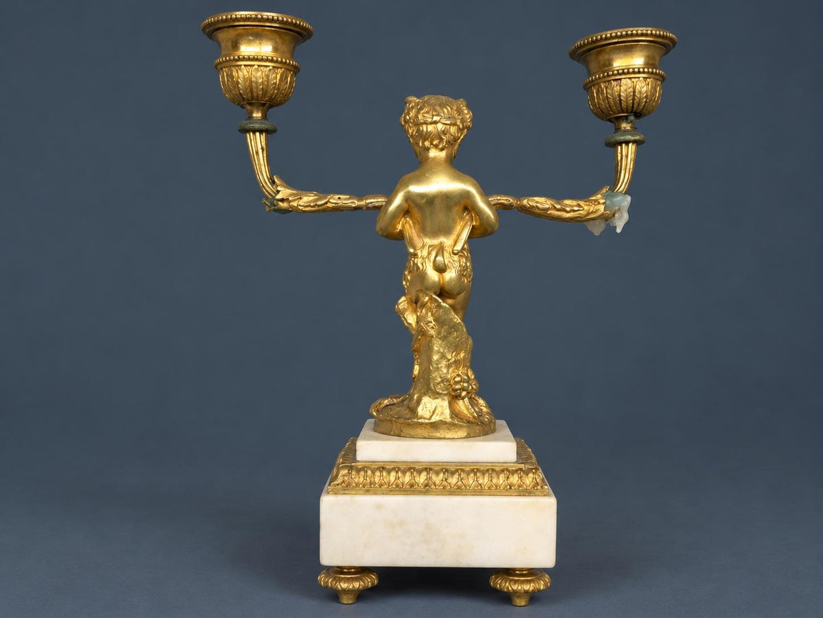 Pair of Antique Napoleon III Gilt Bronze Faun Candelabra, Young Satyrs Holding Laurel Garland Arms, White Marble Bases