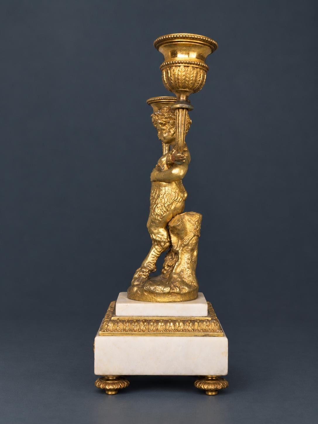 Pair of Antique Napoleon III Gilt Bronze Faun Candelabra, Young Satyrs Holding Laurel Garland Arms, White Marble Bases