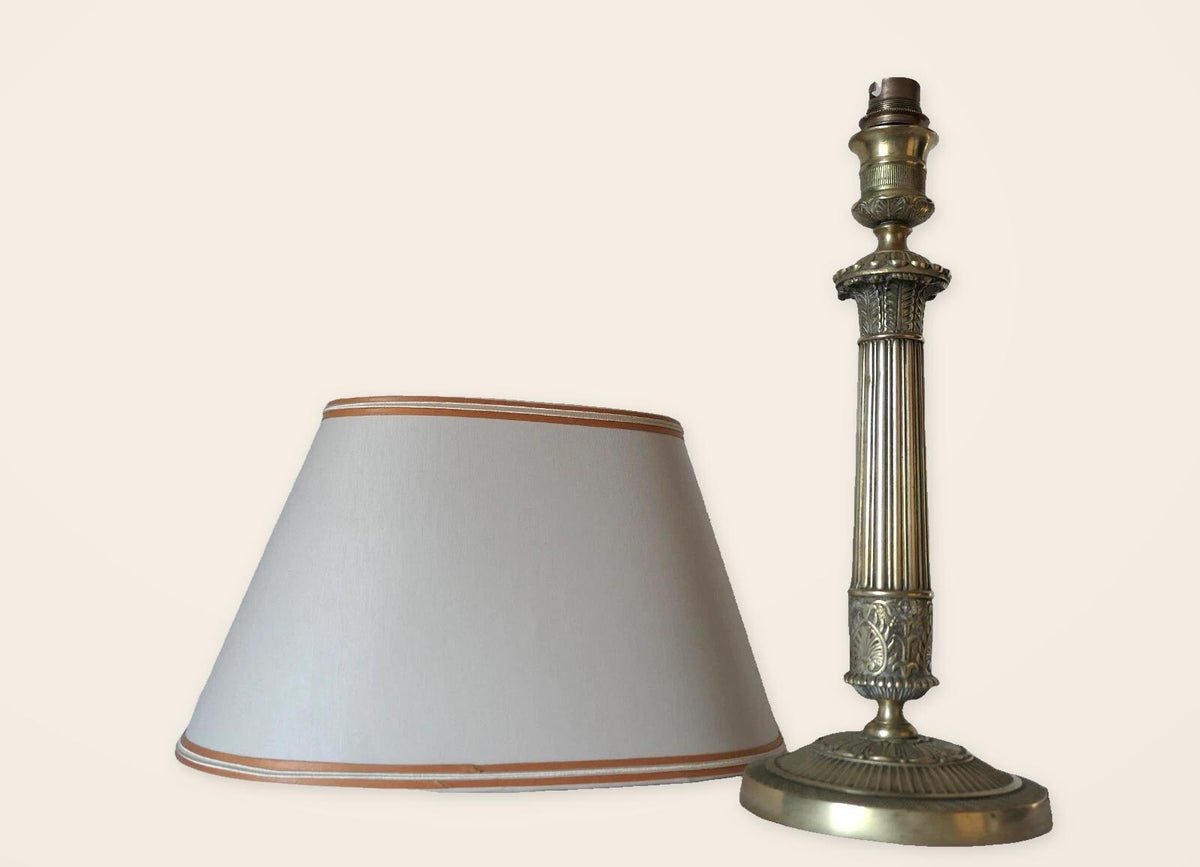 Vintage Empire Style Bronze Column Table Lamp, Fluted Candlestick Base with Palmette Band, Oval Ivory Shade with Apricot Trim