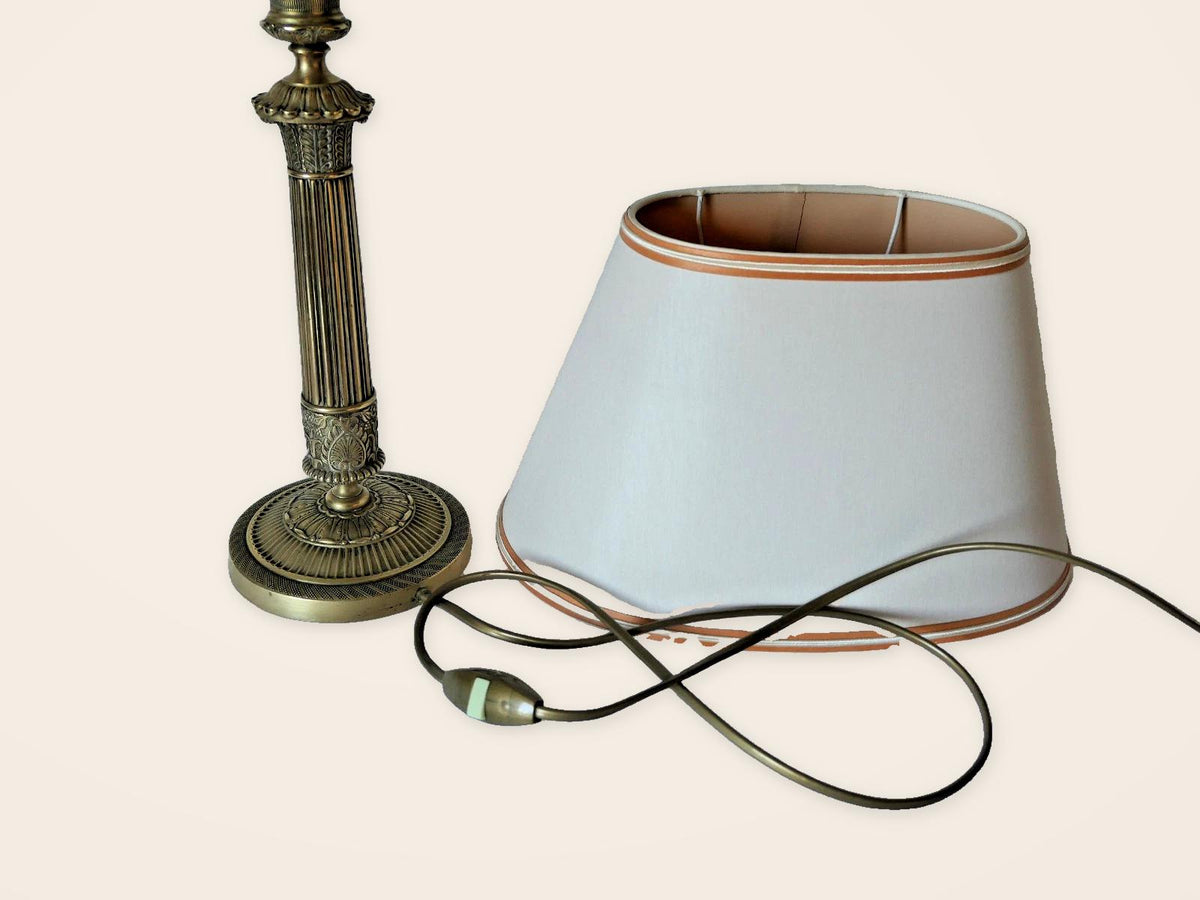 Vintage Empire Style Bronze Column Table Lamp, Fluted Candlestick Base with Palmette Band, Oval Ivory Shade with Apricot Trim