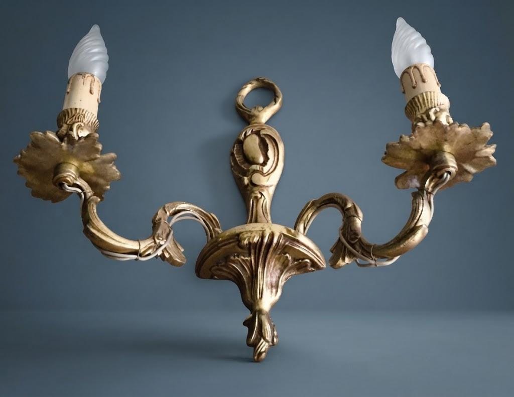 Pair of Vintage 1970s Bronze Louis XV Style Wall Sconces, Two-Arm Design with Laurel Ring Crest and Cartouche Backplate, Candle Lights