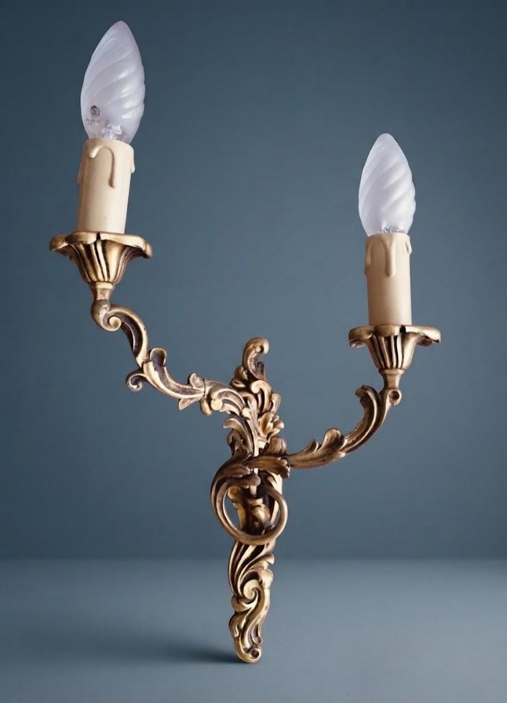 Pair of Vintage 1970s Bronze Louis XV Style Wall Sconces, Asymmetric Two-Arm Rocaille Design with Fluted Cups, Mirrored Candle Lights