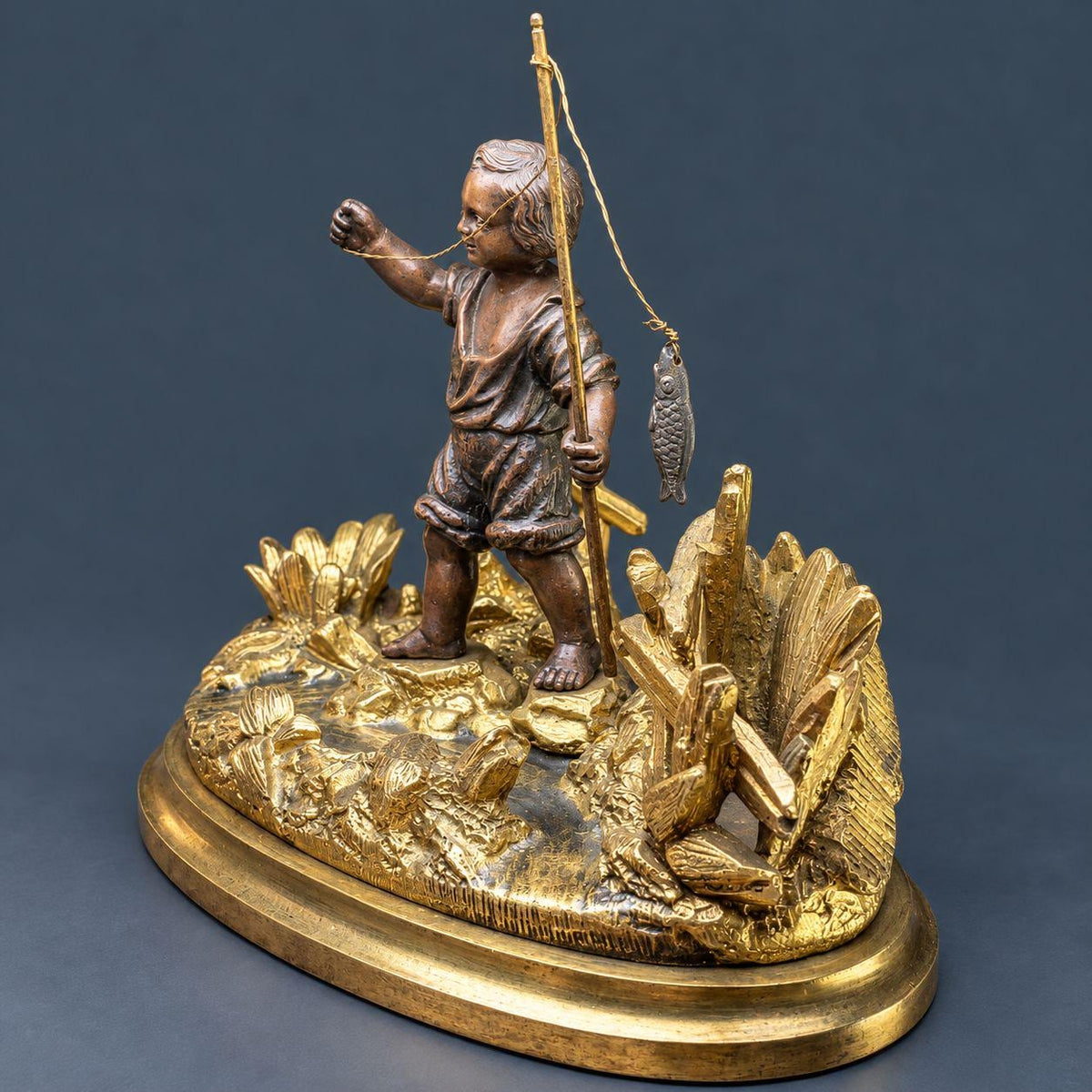 Antique 19th Century Gilt Bronze Match Holder, Young Boy Fishing with Rod and Fish on Reed-Covered Bank, Smoker’s Pyrogene