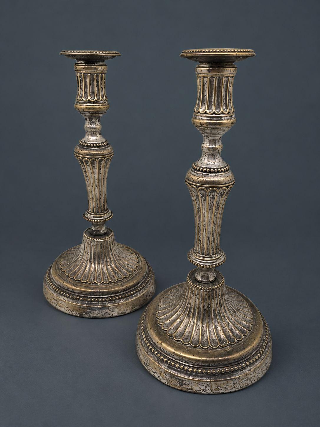 Pair of Antique 18th Century Louis XVI Silvered Bronze Candlesticks, Fluted Baluster Stems and Beaded Bands, Round Bases