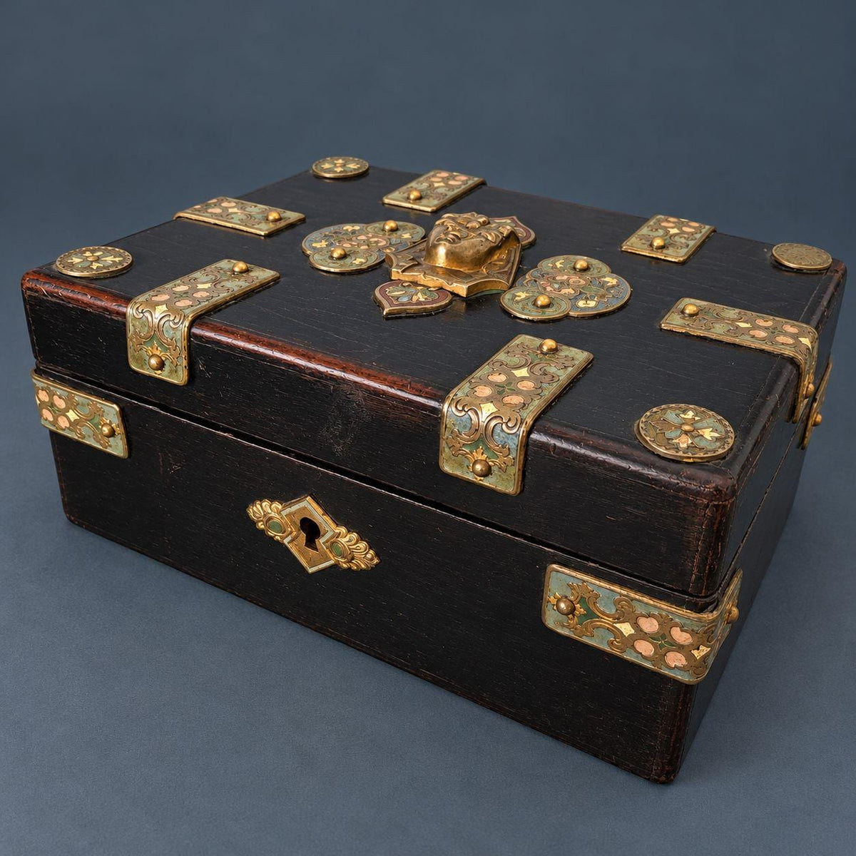 Antique Napoleon III Egyptian Revival Ebonized Box with Enameled Brass Pharaoh Head and Strapwork Mounts, Purple Silk Lining