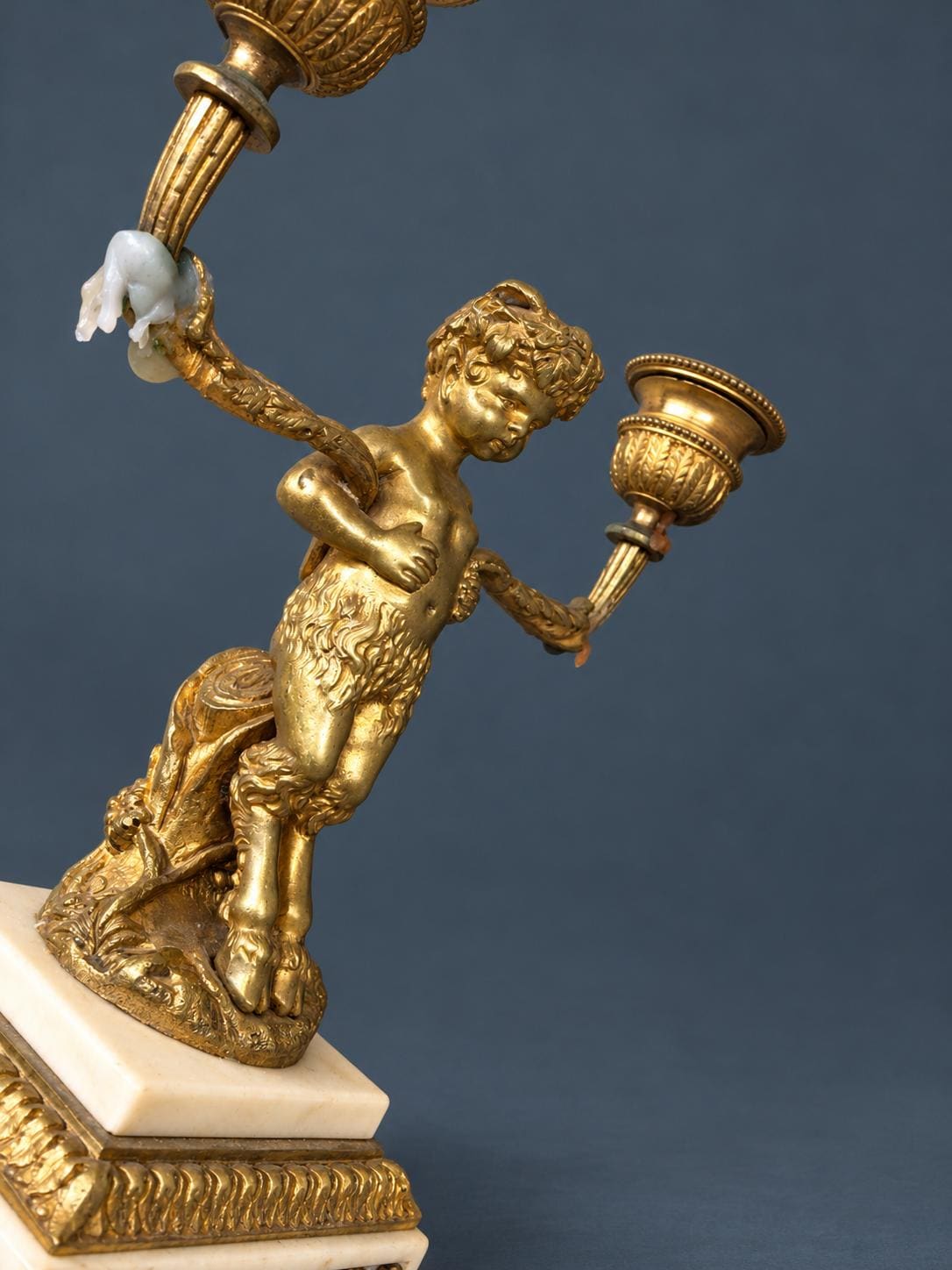 Pair of Antique Napoleon III Gilt Bronze Faun Candelabra, Young Satyrs Holding Laurel Garland Arms, White Marble Bases
