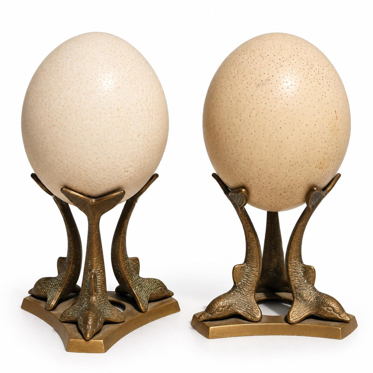 Pair of Vintage Ostrich Eggs on Brass Dolphin Stands, Three Leaping Dolphins Tripod Bases, Hollywood Regency Curiosity