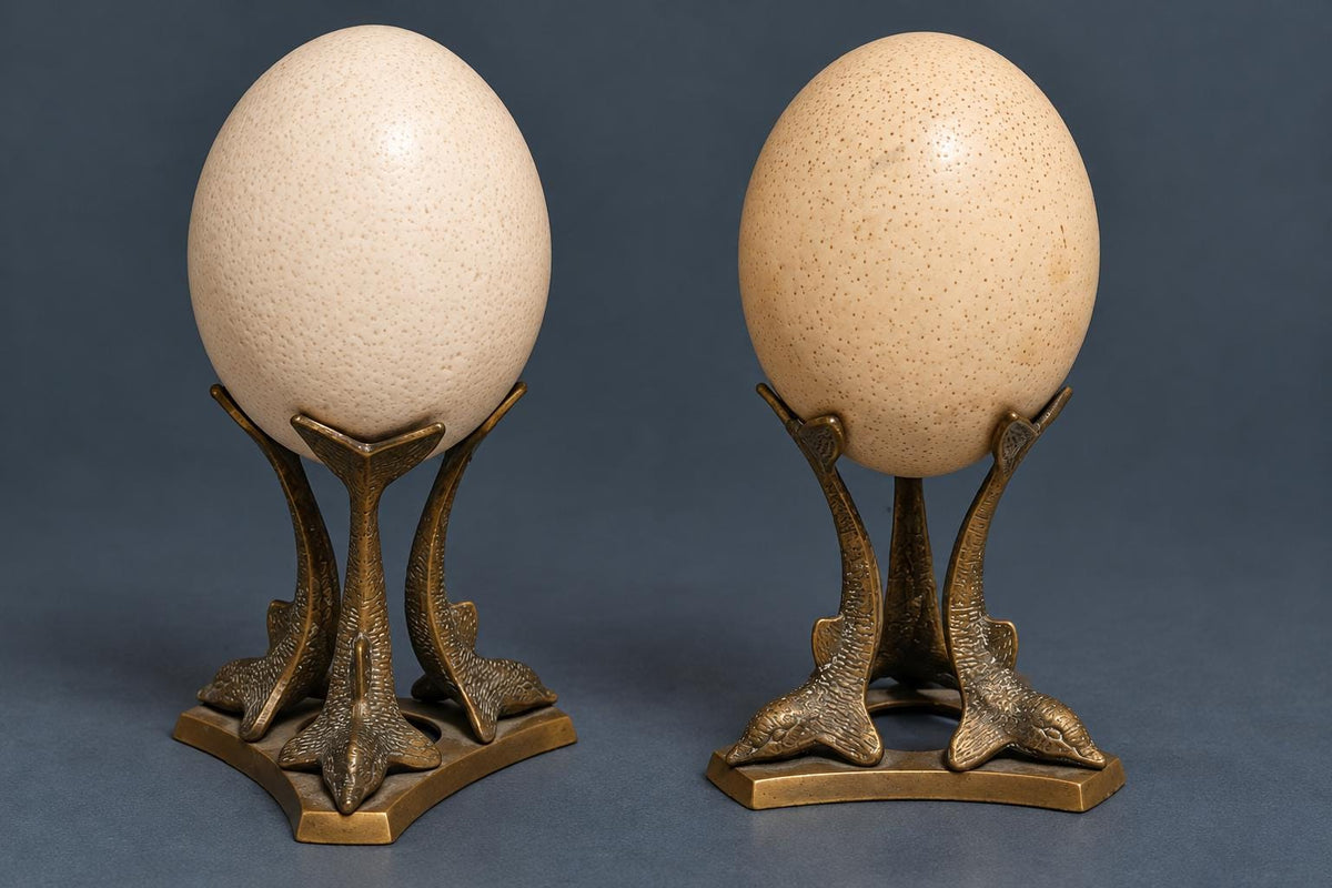 Pair of Vintage Ostrich Eggs on Brass Dolphin Stands, Three Leaping Dolphins Tripod Bases, Hollywood Regency Curiosity