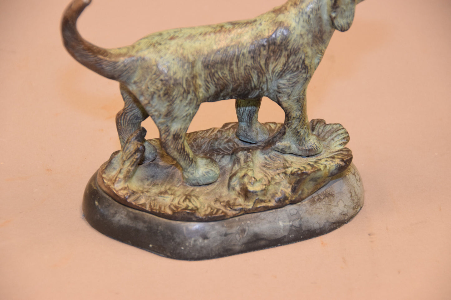 Bronze dog sculpture on marble base