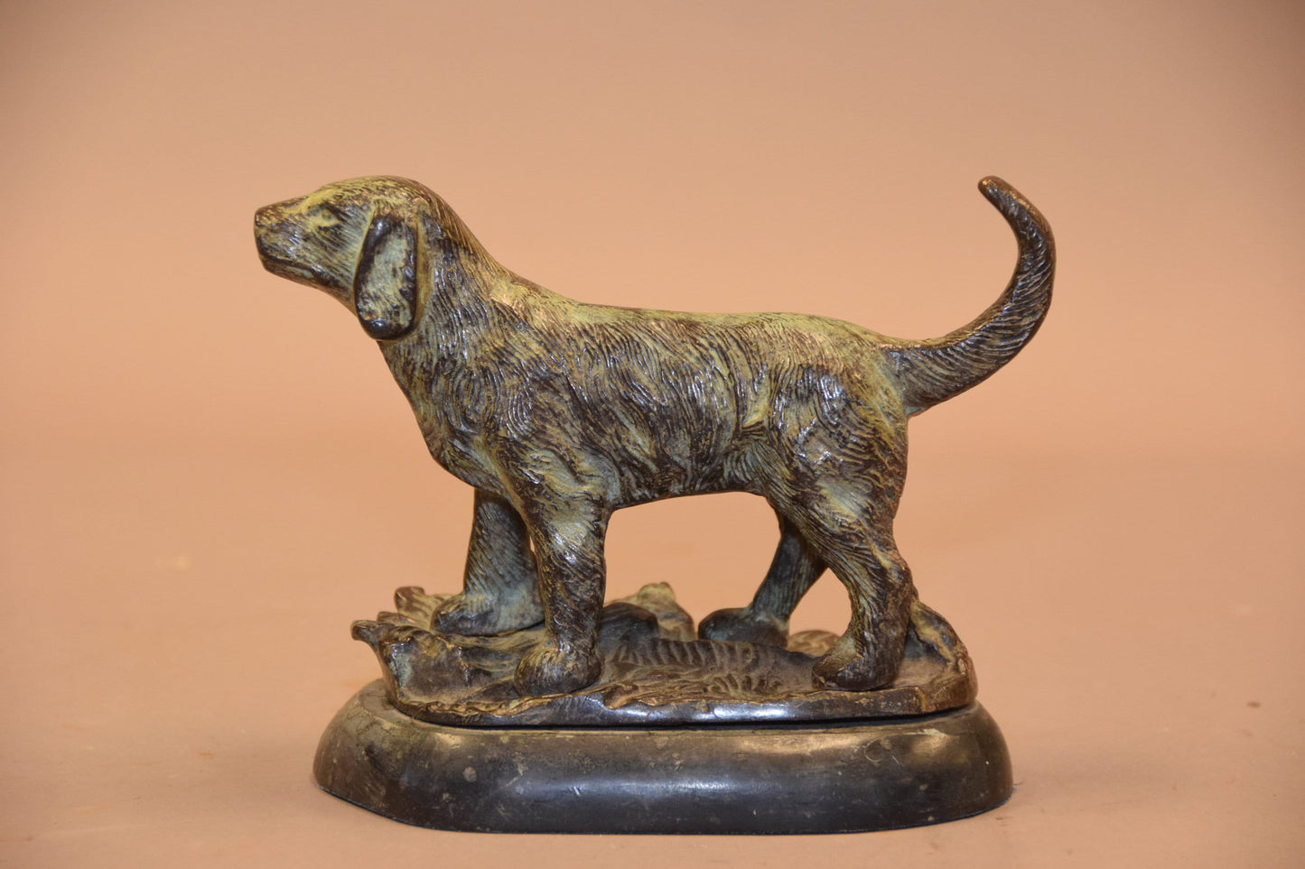 Bronze dog sculpture on marble base