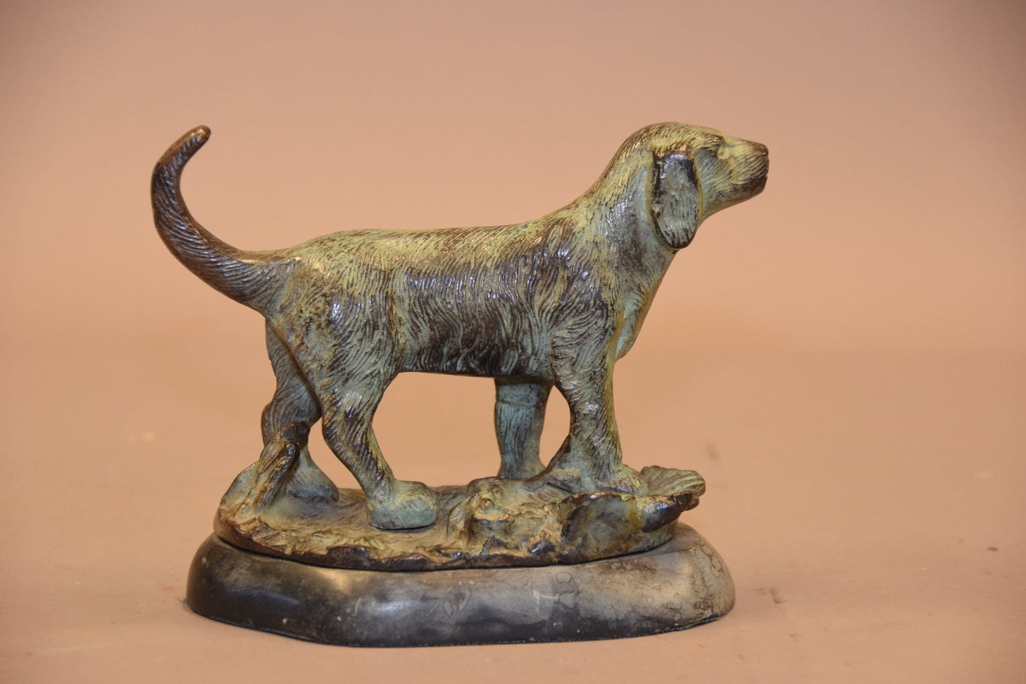 Bronze dog sculpture on marble base