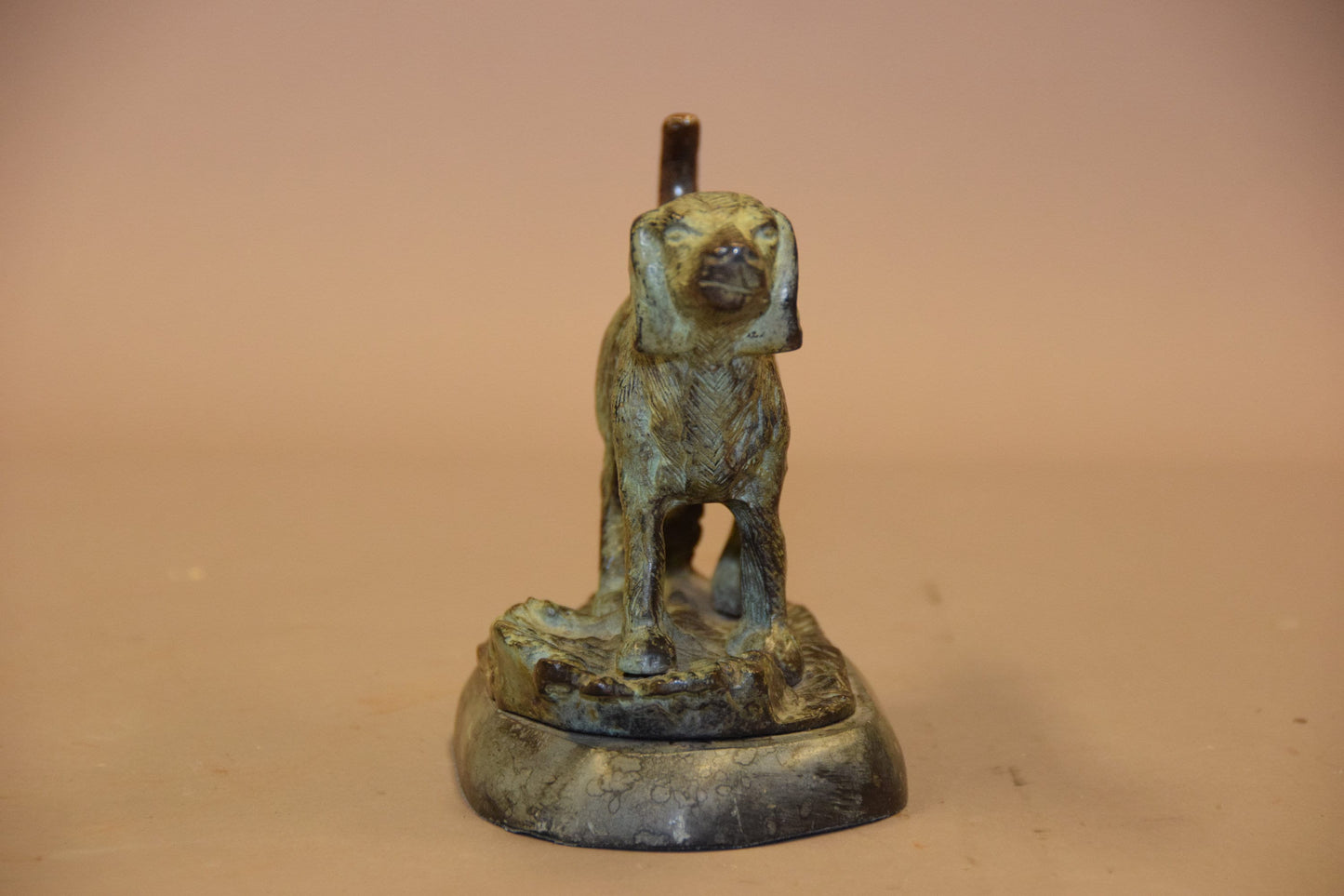 Bronze dog sculpture on marble base